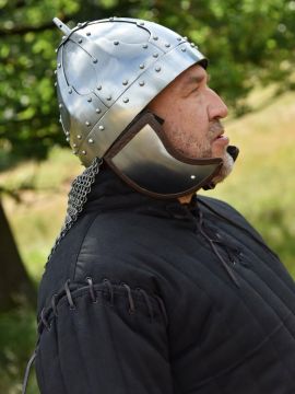 Rivited plate helmet with cheek flap